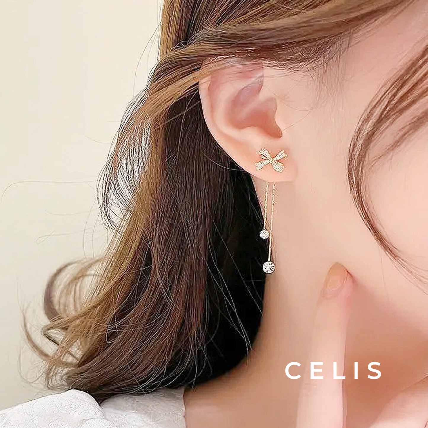 Ribbon Tassel Zirconia Earrings